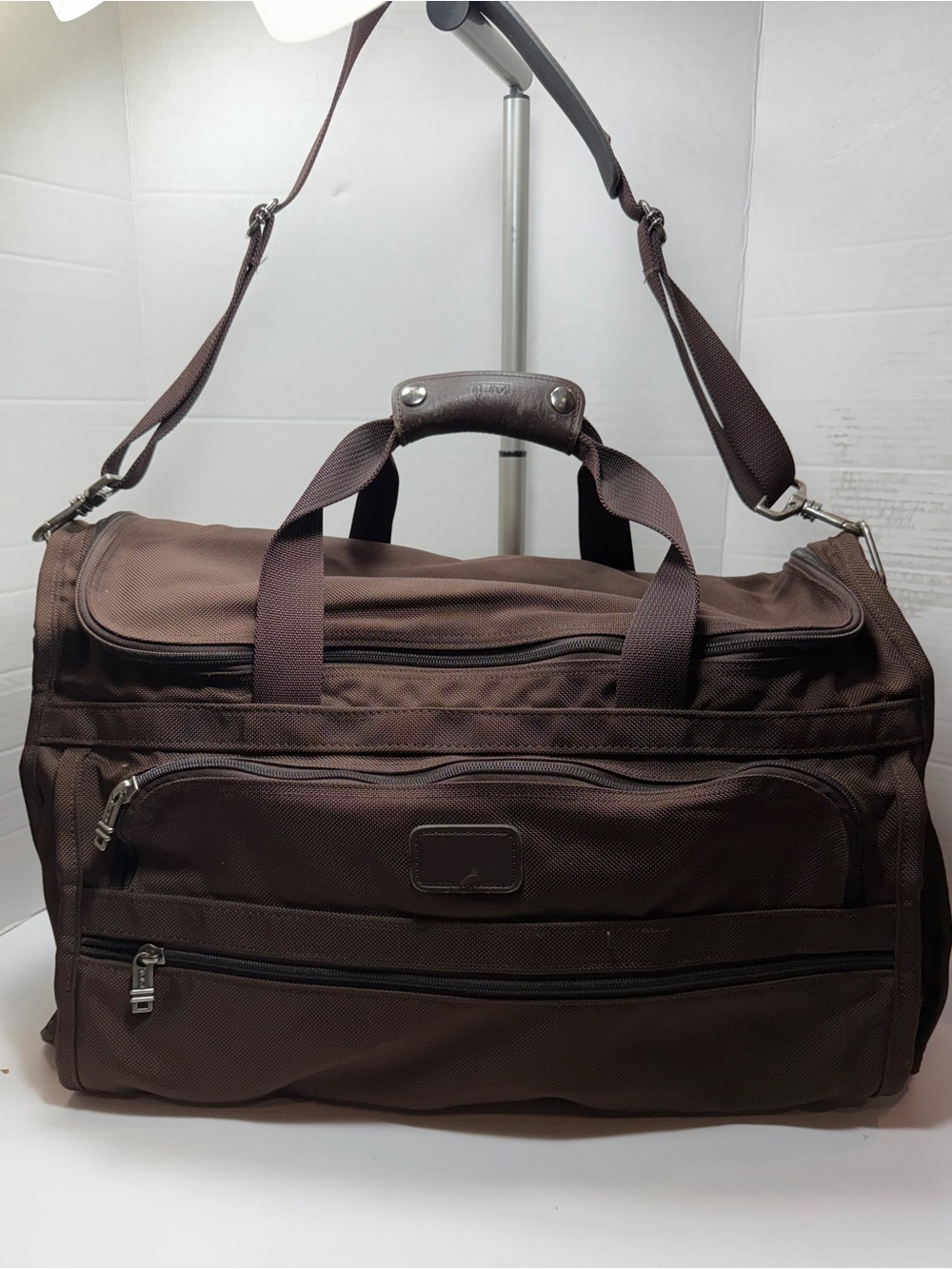 TUMI Leather-Trimmed Canvas Weekender with strap